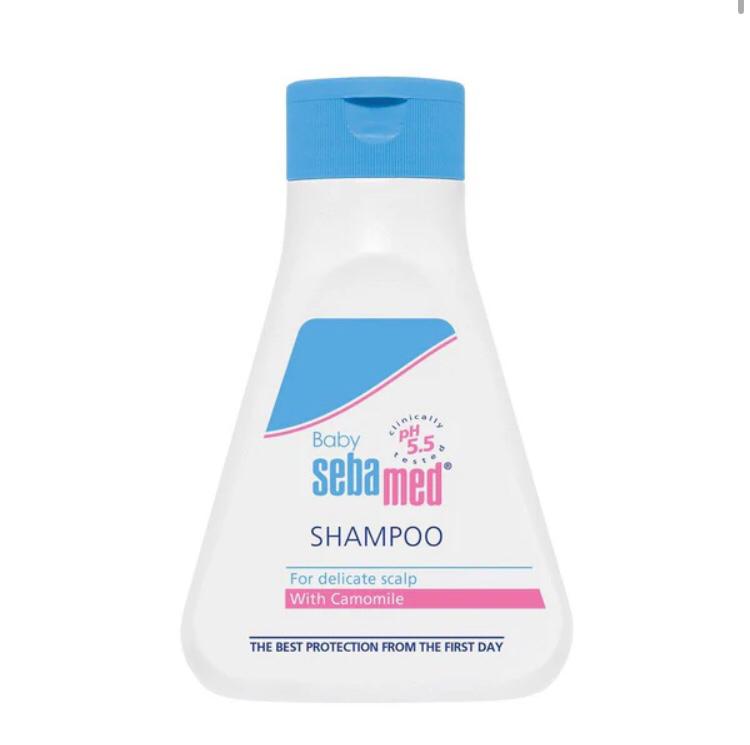 Sebamed baby shampoo bottle with blue cap on a white background