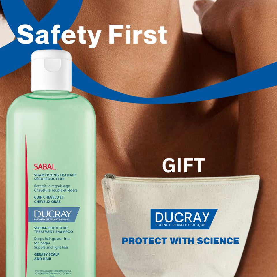 Ducray hair care product set with 'Safety First' text and a blue ribbon.
