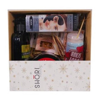 Box with various items including a bottle, a jar, and a box of tea, with a visible brand name 'SHORI' on a white background.