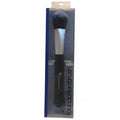Foundation brush in packaging on a beige background