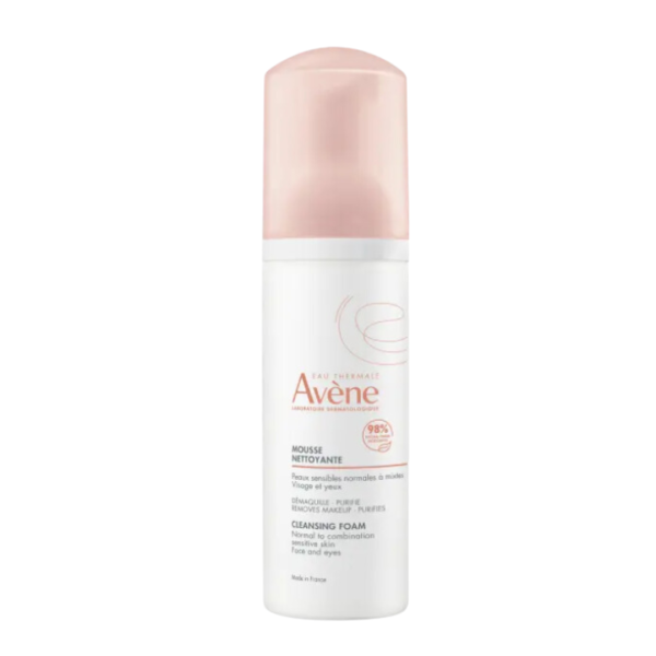 Avene cleansing foam bottle with pink cap on a white background