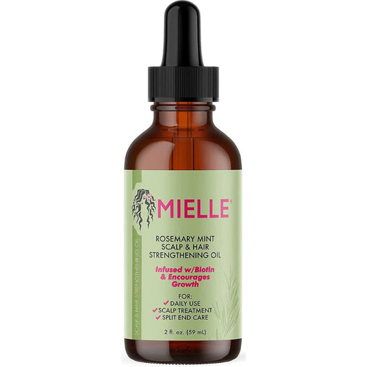 Mielle oil bottle with green label on a white background
