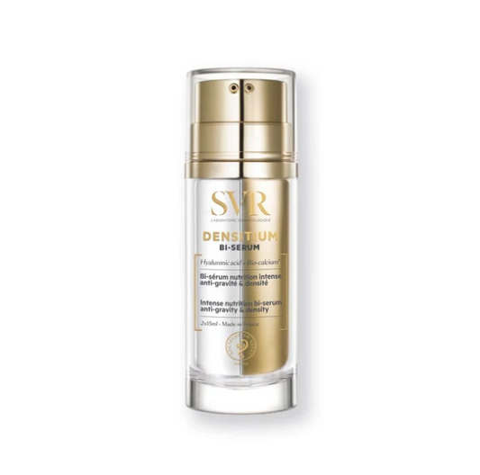 Skincare serum bottle with gold cap and label on a white background