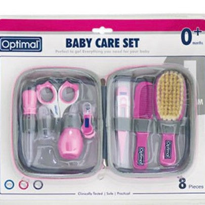 Baby care set with pink tools in a clear case on a white background