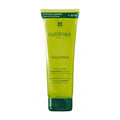 Green shampoo bottle with Furterer branding on a white background