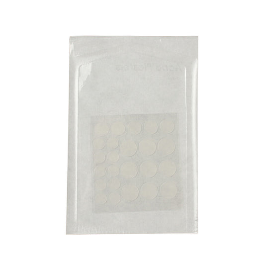 Clear plastic packaging with white circular items inside on a white background